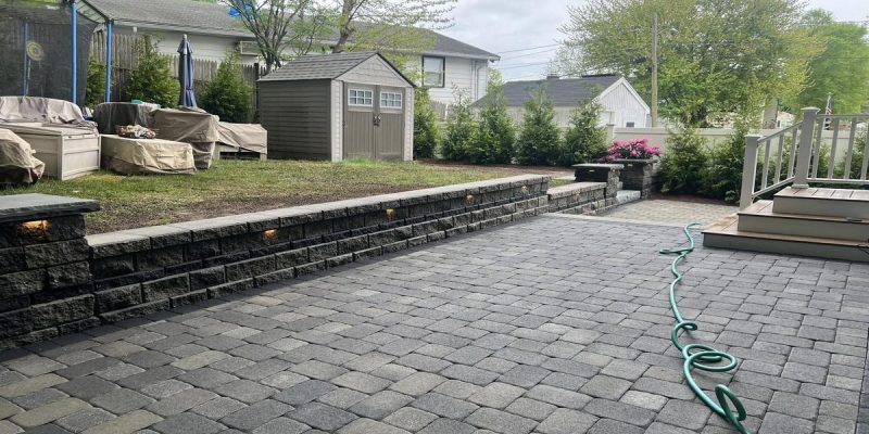 interlocking paver patio paving installation with retaining wall