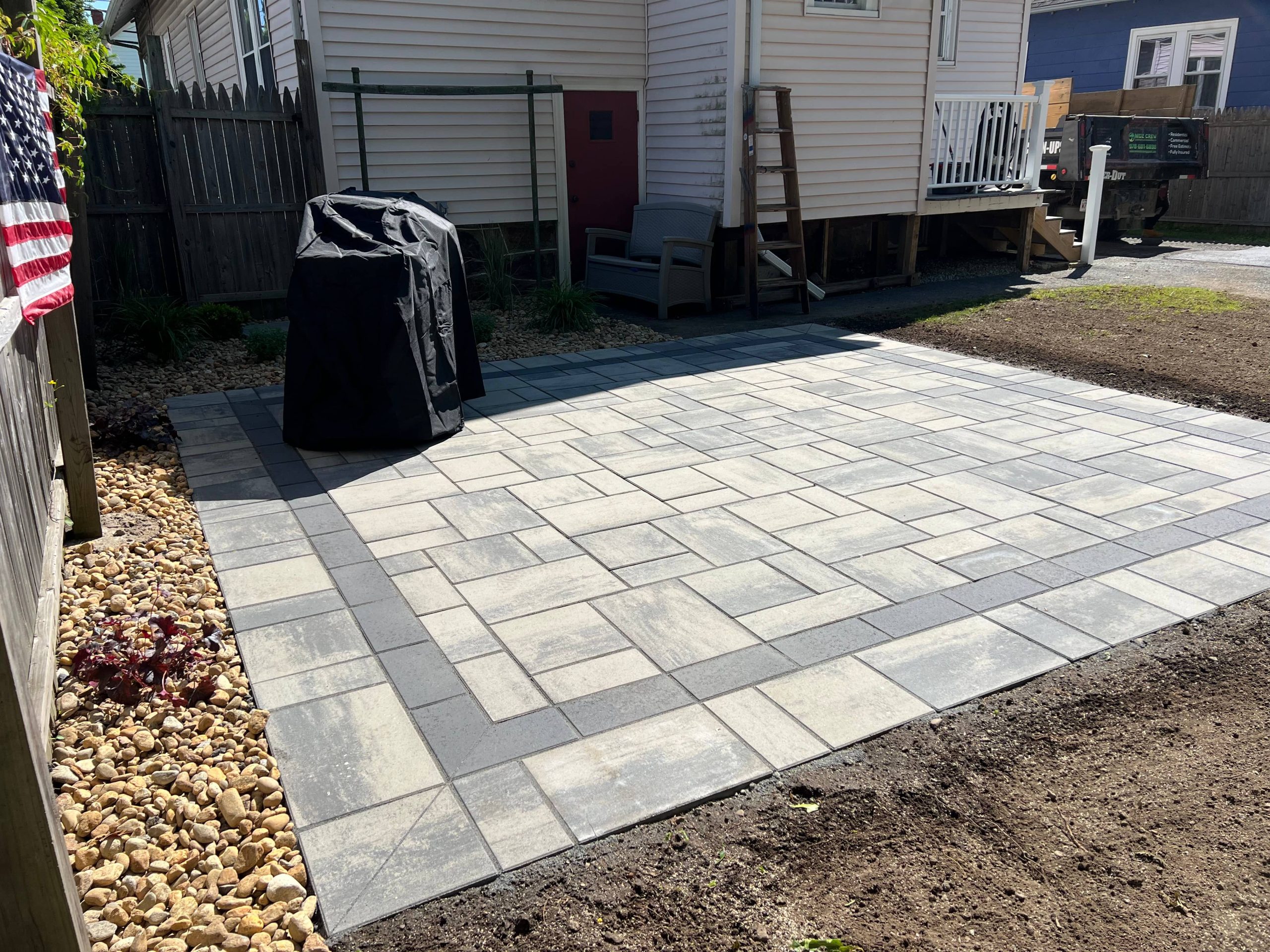 Permeable paver patio installation designed to improve water drainage and prevent flooding