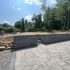 newly paved driveway with retaining wall showing ideal weather for paving contractor work