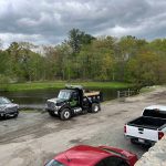 top questions to ask before hiring a paving contractor mdz crew landscaping Dump truck and paving contractor vehicles at residential job site showing asphalt paving and driveway paving services by MDZ Crew Landscaping.