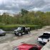 Dump truck and paving contractor vehicles at residential job site showing asphalt paving and driveway paving services by MDZ Crew Landscaping.