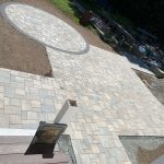custom interlocking paver patio circular gathering area Custom interlocking paver patio with a circular gathering area and contrasting border installed by MDZ Crew Landscaping