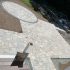 Custom interlocking paver patio with a circular gathering area and contrasting border installed by MDZ Crew Landscaping