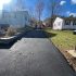 Freshly paved residential asphalt driveway completed by MDZ Crew Landscaping with professional driveway paving services.