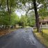 Freshly paved residential asphalt driveway with properly supported edges for improved durability and long-term performance.