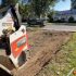 Residential excavation for patio installation using a compact skid steer to prepare a backyard